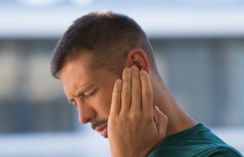Man suffering from earache