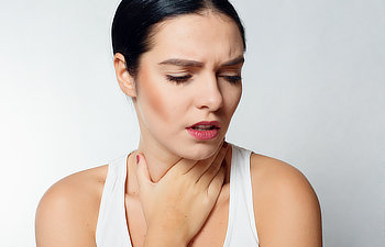 woman with sore throat